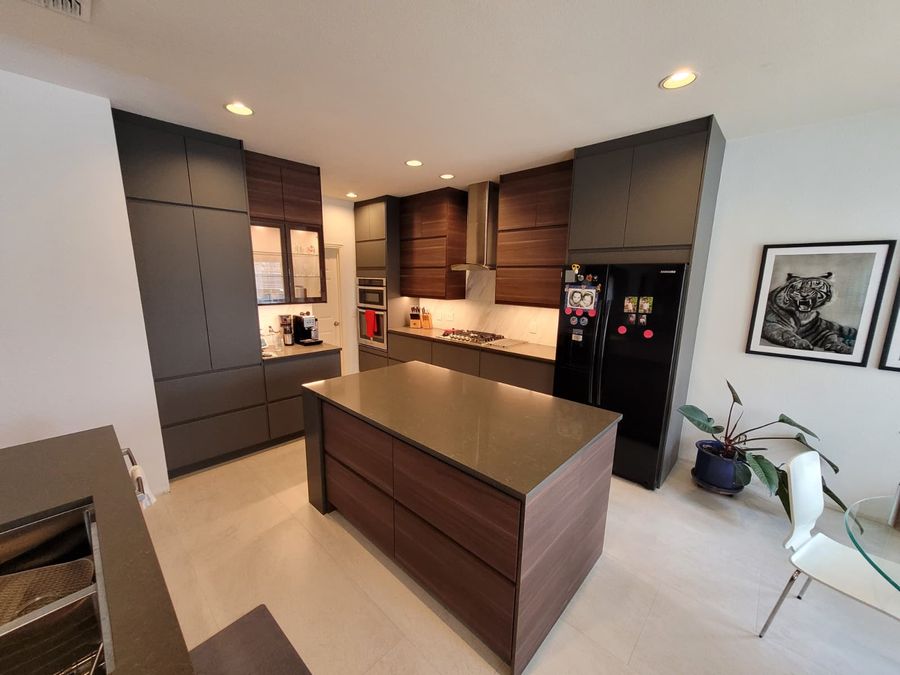 Walnut and graphite kitchen cabinetry with a center island installed by D&L Excellence Services